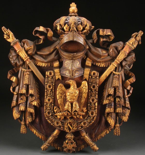 CARVED NAPOLEONIC COAT OF ARMS: A LARGE AND IMPRESSIVE NAPOLEONIC CARVED AND GILT WOOD COAT OF ARMS, 19TH CENTURY. The wooden shield form carved in deep relief with an Imperial Eagle, crossed scepter and Hand of Justice below a crow