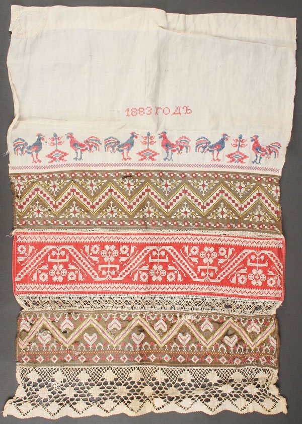 RUSSIAN/UKRAINIAN EMBROIDERED ARTICLES. C 1890: A GROUP OF RUSSIAN/UKRAINIAN EMBROIDERED ARTICLES, CIRCA 1890. Comprising a finely embroidered ruzhnik, the top with a band of roosters, dated 1883. 21 inches x 14.5 inches (54 x 36 cm). Together with