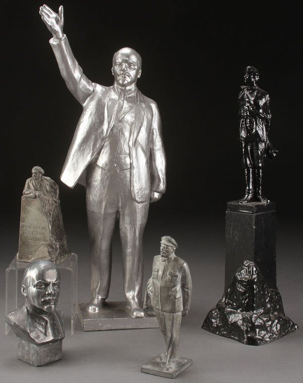 FIVE RUSSIAN SOVIET PATRIOTIC SCULPTRES: A GROUP OF FIVE RUSSIAN SOVIET PATRIOTIC DESK SCULPTURES, CIRCA 1975. Each cast in aluminum, comprising a large figure of the standing Lenin, a black painted sculpture of Maxim Gorky, a figure of Karl
