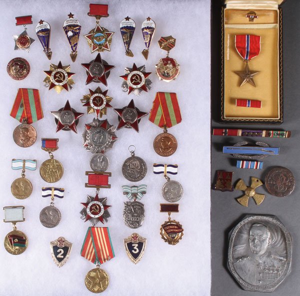 34 RUSSIAN SOVIET BADGES, CIRCA 1945-1995: A GROUP OF 34 RUSSIAN SOVIET BADGES, CIRCA 1945-1995. Including three Orders of the Red Star, the lowest number engraved on verso 542,980; together with four Orders of the Great Patriotic War, 1st and