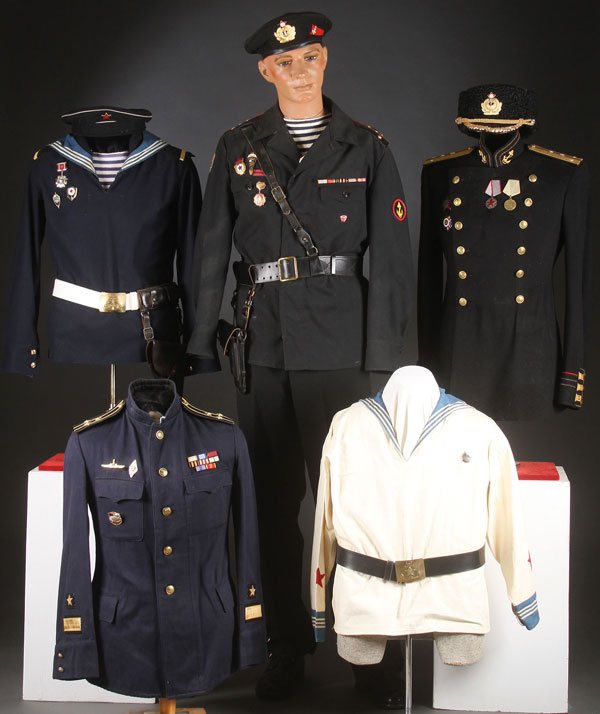 GROUP OF RUSSIAN SOVIET NAVAL UNIFORMS: A GROUP OF RUSSIAN SOVIET NAVAL UNIFORMS, CIRCA 1940-1985. Including Officer’s summer service tunic, enlisted man’s summer pull-over, and an enlisted man’s blue jumper with dress collar, belt an