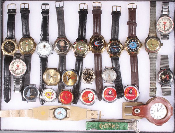 A GROUP OF 24 RUSSIAN SOVIET PERIOD WATCHES: A GROUP OF 24 RUSSIAN SOVIET PERIOD WATCHES. Comprising primarily wristwatches, some displaying patriotic themed faces, others military style. Together with a pocket watch and a pocket knife celebrati