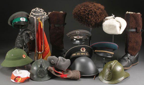 OVER 60 RUSSIAN & OTHER MILITARY HEADGEAR + MORE: A GROUP OF OVER 60 RUSSIAN SOVIET AND EASTERN BLOC MILITARY HEADGEAR AND RELATED MATERIALS. Including hats, helmets, boots, medical kit, goggles, canteens, fuel can, banners, as well as other headgear