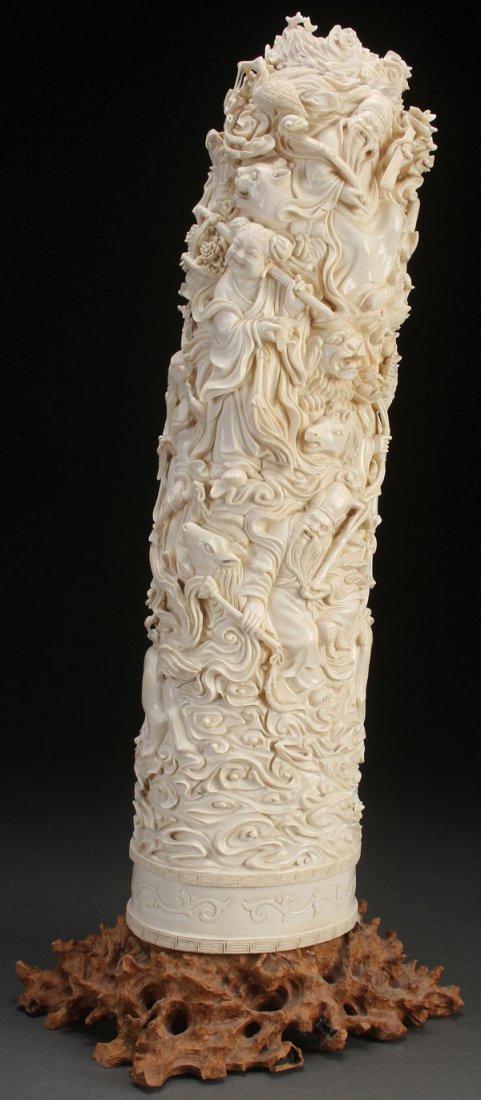 CHINESE CARVED IMMORTALS IVORY TUSK, CIRCA 1925: A VERY FINE CHINESE CARVED “IMMORTALS” IVORY TUSK, CIRCA 1925. Fully carved in the round in deep relief and good detail with a densely packed scene of eight various Immortals, an attendant and oth