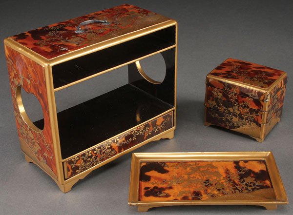 A JAPANESE MINIATURE TORTOISE SHELL JUBAKO, EDO-MEIJI: AN EXTREMELY FINE JAPANESE MINIATURE JUBAKO, EDO-MEIJI PERIOD (19TH CENTURY). In tortoise shell overlaid black lacquer and finely decorated in silver and gold enamels with a flowering landscape. Compr