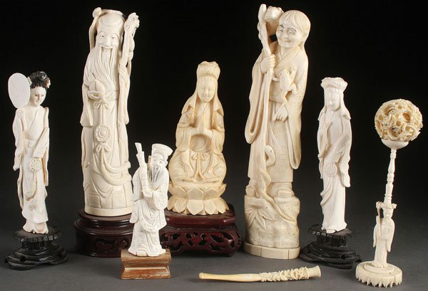 8 PC GROUP OF CHINESE & JAPANESE CARVED FIGURES: AN EIGHT PIECE GROUP OF CHINESE AND JAPANESE CARVED IVORY FIGURES, CIRCA 1950 AND EARLIER. Each fully carved in the round depicting various gods and Immortals together with a mystery ball on figural p