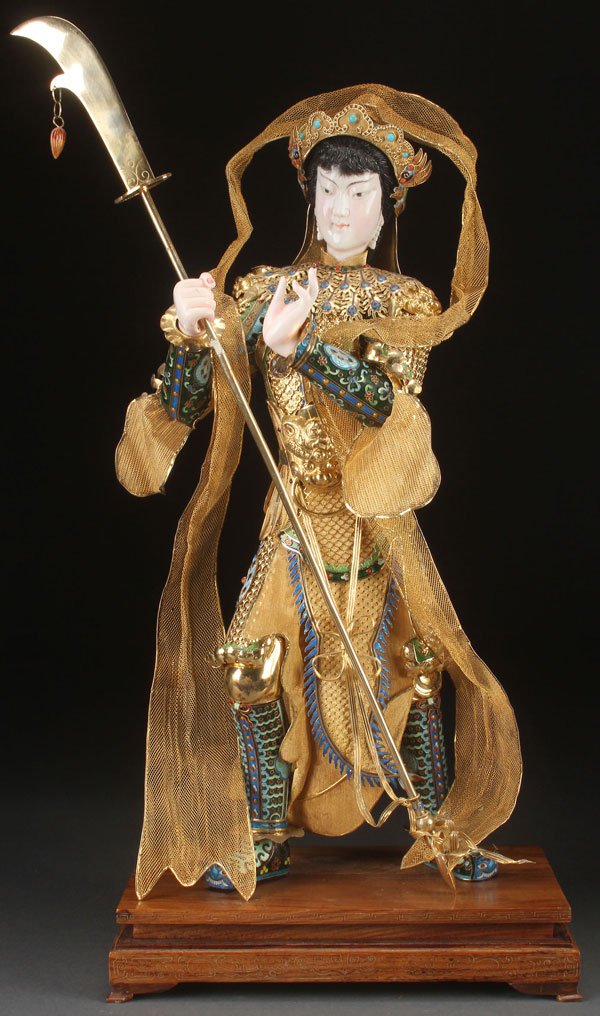 CHINESE ENAMELED SILVER & IVORY FIGURE: A LARGE CHINESE CARVED IVORY AND ENAMELED SILVER-GILT FIGURE, CIRCA 1950. Depicting a standing figure dressed as a temple guardian in elaborate gilt and enameled metal armor with trailing woven gilt