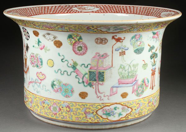 A LARGE CHINESE ENAMELED PORCELAIN CACHE POT: A LARGE CHINESE ENAMELED PORCELAIN CACHE POT. Of cylindrical form with flared everted rim decorated throughout with various Buddhist symbols between borders of scrolled foliage and floral cartouches o