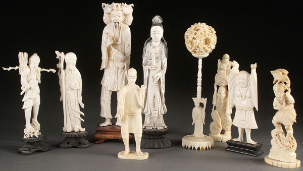 9 PC GROUP OF ORIENTAL CARVED IVORY FIGURES: A NINE PIECE GROUP OF ORIENTAL CARVED IVORY FIGURES AND ORNAMENTS, CIRCA 1950 AND EARLIER. All fully carved comprising various gods and Immortals and a puzzle ball on stand. The largest 9.25 inches (2