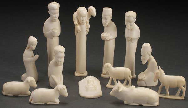 13 PC AFRICAN CARVED IVORY NATIVITY SET, C 1950: A THIRTEEN PIECE AFRICAN CARVED IVORY NATIVITY SET, CIRCA 1950. Appears complete. The largest height 4 inches (10 cm). The offered lot is accompanied with a “certified appraisal” as illustrated. I