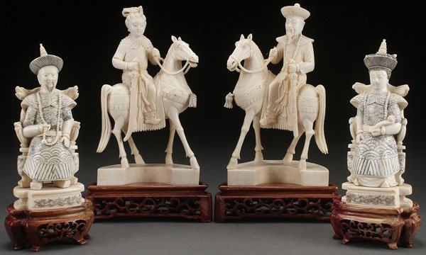 A GROUP OF FOUR CHINESE CARVED IVORY FIGURES: A GROUP OF FOUR CHINESE CARVED IVORY FIGURES, CIRCA 1930. Each depicting an Emperor and Empress with one pair mounted on horseback and one pair seated in thrones, each with incised marks on base and r