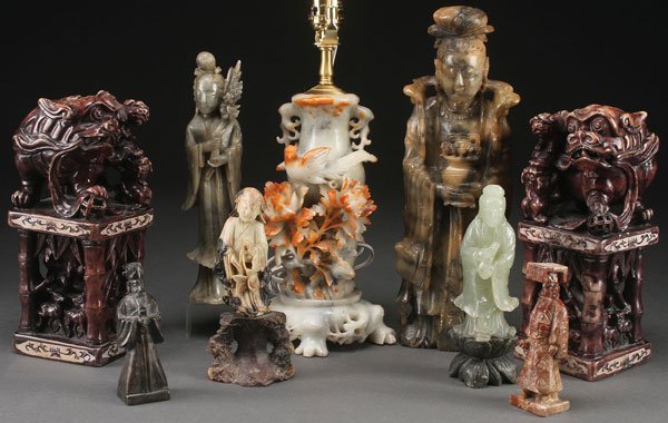 9 PC COLLECTION OF CHINESE CARVED SOAPSTONE: A NINE PIECE COLLECTION OF CHINESE CARVED SOAPSTONE FIGURES AND ORNAMENTS, 20TH CENTURY. Comprising a large pair of embossed seals, each sculpted as Foo lions with young atop bamboo form pedestals car