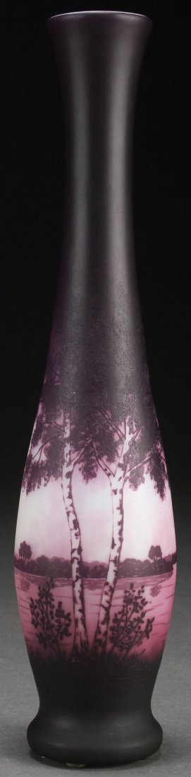 A D’ARGENTAL FRENCH CAMEO ART GLASS VASE: A D’ARGENTAL FRENCH CAMEO ART GLASS VASE, EARLY 20TH CENTURY. Of elongated bottle form in opaque colored glass, overlaid with amethyst, cut with a birch tree lined lake scene. Signed in cameo “D��