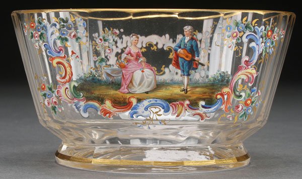 A LOBMEYR ENAMELED CRYSTAL FINGER BOWL: A LOBMEYR ENAMELED CRYSTAL FINGER BOWL, LATE 19TH CENTURY. Of oval cut panel form enameled with a romantic courting scene. Inscribed on base with monogram in gilt. Height 2.75 inches (6.8 cm).