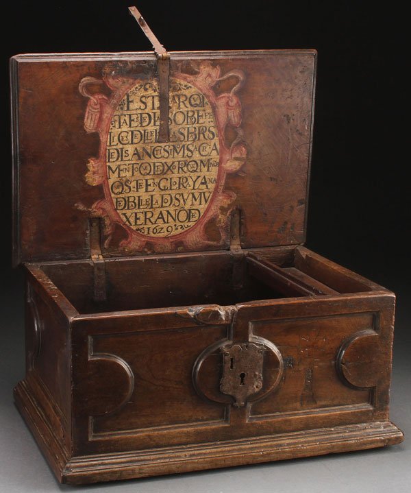 17TH C SPANISH CARVED & POLYCHROME WALNUT CASKET: AN INTERESTING 17TH CENTURY SPANISH CARVED AND POLYCHROME WALNUT CASKET. Of rectangular form with recessed carved panels, containing raised demi-lune lobes at each corner, the center with a raised ova