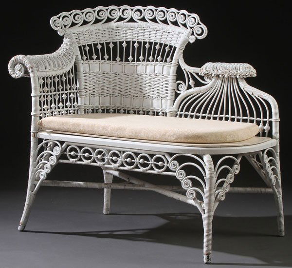 VICTORIAN WICKER PHOTOGRAPHERS BENCH OR RECAMIER: A GOOD VICTORIAN WICKER PHOTOGRAPHERS BENCH OR RECAMIER, LATE 19TH CENTURY. The scrolled woven arm rest extending from a curved back support with bent scrolled panel raised on four saber form legs jo