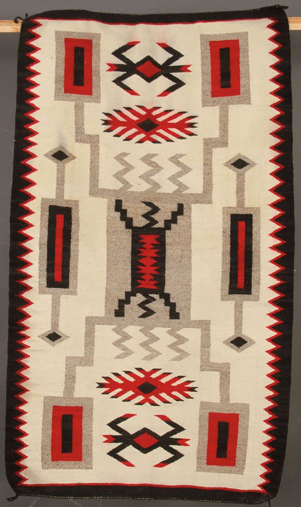 A PAIR OF SOUTHWEST NATIVE AMERICAN HAND WOVEN RUGS: A PAIR OF SOUTHWEST NATIVE AMERICAN HAND WOVEN RUGS, LAST HALF 20TH CENTURY. Comprising a cream, black, red and gray Storm pattern, 56 inches x 33 inches and a cream, gray, black and brown Two Gray Hi