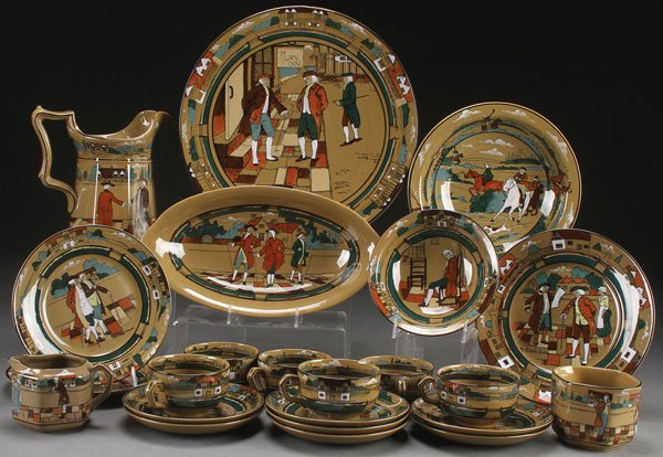 A 23 PIECE COLLECTION OF BUFFALO POTTERY, DELDARE: A 23 PIECE COLLECTION OF BUFFALO POTTERY, DELDARE WARE, EARLY 20TH CENTURY. Comprising a "Lion Inn" charger, a “To Demand My Annual Rent” pitcher, a "Fallow field" bowl, "Town Crier" plate, "Olde