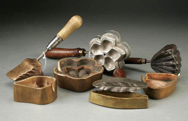 A BRASS LEAF IRON BY MOLLA TOOL together with thr