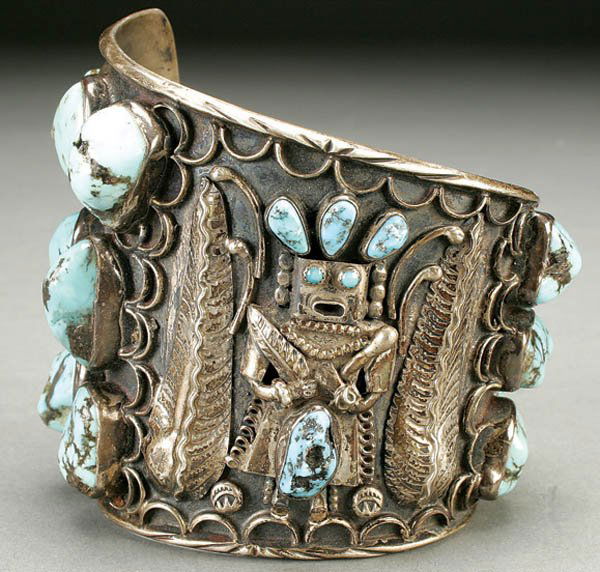 W.H. BILLINGSLY HOPI SILVER & TURQUOISE BRACELET: W.H. BILLINGSLY HOPI SILVER & TURQUOISE BRACELET mid 20th century, with applied decoration and 14 large turquoise cabochons, inscribed "W.H. Billingsly - White Chief of Hopi People - to David B. David