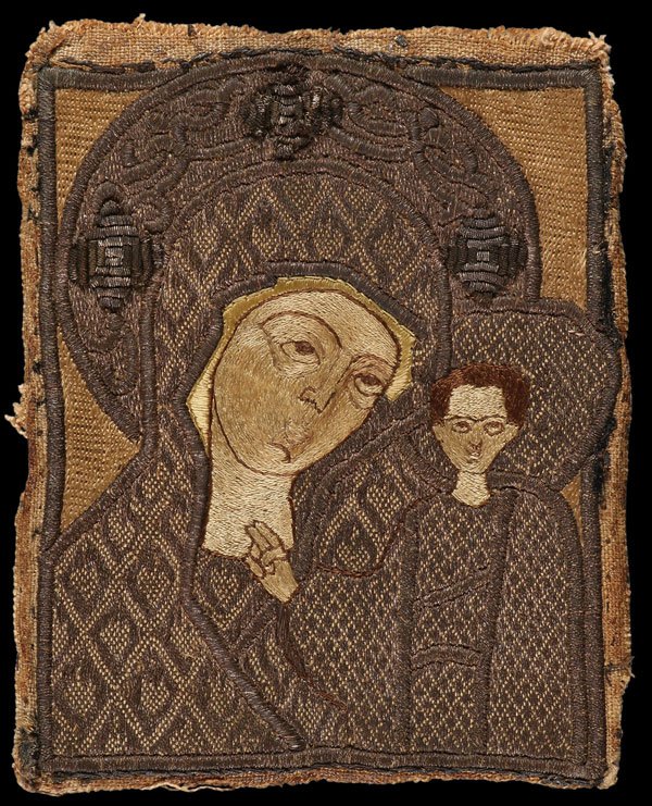 RARE 17TH CENTURY STROGANOV EMBROIDERED RUSSIAN ICON: A SCARCE & VERY FINE RUSSIAN EMBROIDERED ICON OF THE KAZAN MOTHER OF GOD, CIRCA 1650, STROGANOV WORKSHOP, SOLVYCHEGODSK. Rendered in silver brocade and colored silk thread, depicting the standard Kaza