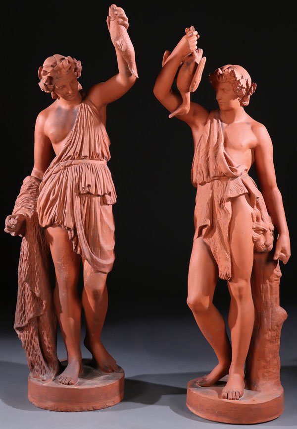 A PAIR OF TERRA COTTA GARDEN SCULPTURES, 20TH C: A PAIR OF TERRA COTTA GARDEN SCULPTURES, 20TH CENTURY. Depicting two classical sculpted figures, one of a nude female with fishing net and catch; the other a male with lion skin cloak holding a duck. 