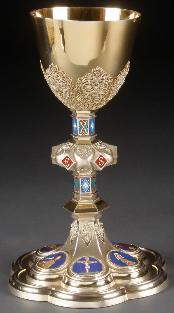 A FRENCH SILVER GILT & ENAMEL GOTHIC CHALICE: A FINE FRENCH SILVER GILT AND ENAMEL GOTHIC STYLE CHALICE, DEMARQUET FRERES, PARIS, 1893. The sixed lobed base raised and set with six shaded and champlevé finely enameled medallions depicting the Cr