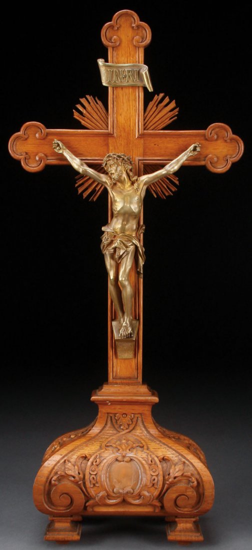 A GILT BRONZE AND CARVED WOOD ALTAR CRUCIFIX: A VERY FINE GILT BRONZE AND CARVED WOOD ALTAR CRUCIFIX, FRENCH, 19TH CENTURY. The wood base resting on four squared baluster feet supporting a wood base ornately carved overall with flowers, scrolling