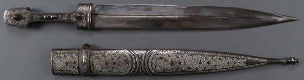 A PAIR OF SILVER AND NIELLO MOUNTED KINDJALS: A PAIR OF SILVER AND NIELLO MOUNTED KINDJALS, 19TH AND 20TH CENTURY. The first a later example with double edged blade with double central fuller set in a silver-gilt and niello handle and similarly
