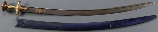A VERY FINE MUGHAL TULWAR-TEGHA SWORD, 19TH C: A VERY FINE MUGHAL TULWAR-TEGHA SWORD, 19TH CENTURY. Slightly curved single edge wide damascus blade with reinforced spine and back edge, the forte with inlaid gilt cartouche in Arabic script, the iro