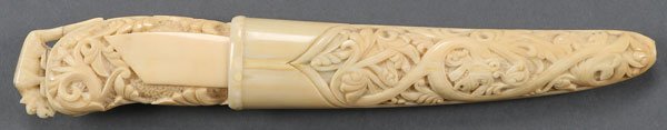 A VERY FINE CONTINENTAL CARVED IVORY DAGGER: A VERY FINE CONTINENTAL CARVED IVORY DAGGER, 19TH CENTURY. The hilt ornately carved overall with scrolling foliage against a stippled ground and the pommel with finial carved as a panther and set with