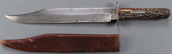 A CLIP POINT BOWIE KNIFE BY G. GELSTON MFG. CO.: A CLIP POINT BOWIE KNIFE BY G. GELSTON MFG. CO., CIRCA 1900. Clip point blade marked at ricasso "G. GELSTON/MFG. CO.", oval brass cross guard, antler grip scales with small rectangular German silver p