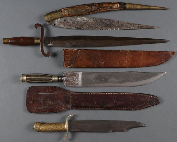 A GROUP OF FOUR FIGHTING KNIVES, 19TH CENTURY: A GROUP OF FOUR FIGHTING KNIVES, 19TH CENTURY. Comprising a large clip point knife with flat polished single edge blade showing some Damascus patterning, the back of tip sharpened, the ricasso chisele