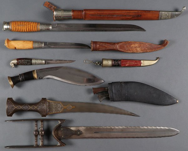 AN INTERESTING GROUP OF SIX VARIOUS EDGED WEAPONS: AN INTERESTING GROUP OF SIX VARIOUS EDGED WEAPONS, 2nd HALF 20TH CENTURY. Comprising a Katar with split blade with serrated edges, length 21 inches (53.5 cm), an Indo-Persian style dagger with slightl