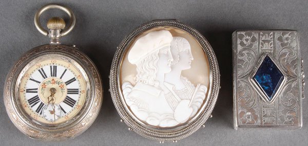 A GROUP OF THREE CONTINENTAL OBJETS DE VERTU: A GROUP OF THREE CONTINENTAL OBJETS DE VERTU, CIRCA 1900. Comprising an open face pocket watch with lever-set movement, floral enameled dial, and chased with horses on verso; a silver oval box, the hi