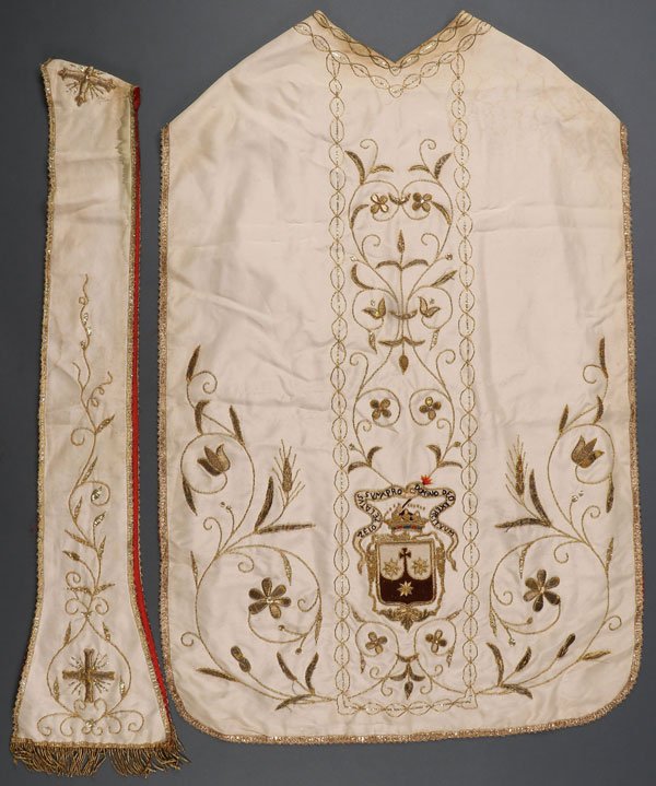 A SILK & BULLION EMBROIDERED FIDDLEBACK CHASUBLE: A SILK AND BULLION EMBROIDERED FIDDLEBACK CARMELITE CHASUBLE AND MATCHING STOLE, CIRCA 1900. The white silk foundation with the front ornately embroidered in bullion flower forms, scrolling foliage, v