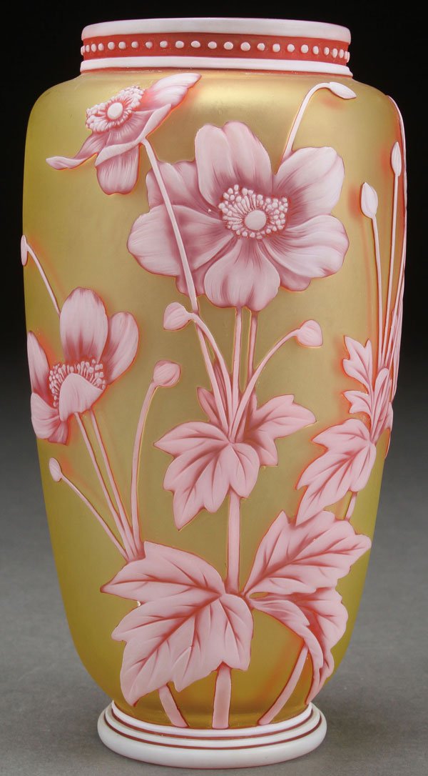 THOMAS WEBB AND SONS THREE COLOR ENGLISH VASE: A VERY FINE THOMAS WEBB AND SONS THREE COLOR ENGLISH CAMEO ART GLASS VASE, LATE 19TH CENTURY. Of tapering cylindrical form in citron colored glass overlaid with red and white. Finely carved with flora