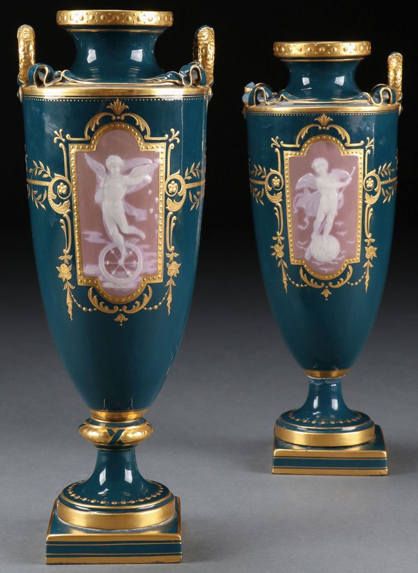 A MINTON ENGLISH PORCELAIN PATE-SUR-PATE URN: A MINTON ENGLISH PORCELAIN PATE-SUR-PATE URN, 19TH CENTURY. The pate-sur-pate scene of a winged figure riding a spoked wheel representing fortune on a mauve colored reserve with tooled and enameled gi