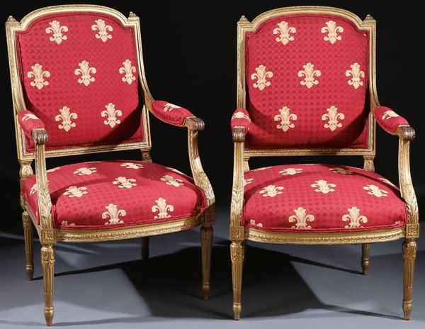 A FINE PAIR OF FRENCH LOUIS XVI STYLE GILT WOOD: A FINE PAIR OF FRENCH LOUIS XVI STYLE GILT WOOD BERGERES. Each carved with acanthus floral rosettes and lappets under a gilt finish and upholstered in a red damask material with woven fleur de lis. He