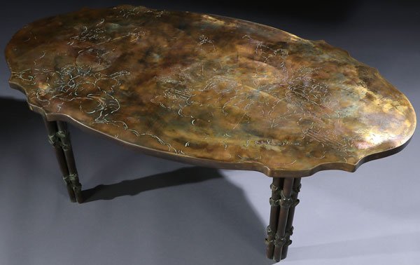 A PHILIP AND KELVIN LAVERNE ETCHED BRONZE “MUSES”: A PHILIP AND KELVIN LAVERNE ETCHED BRONZE “MUSES” COCKTAIL TABLE, CIRCA 1960. The oval bronze top etched with a scenic depiction of classical muses under a variegated patinated finish and raised o