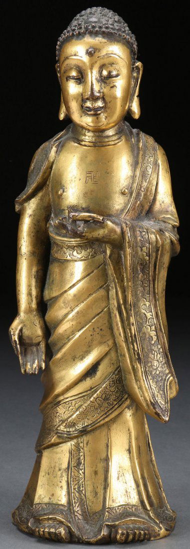 A CHINESE GILT BRONZE STANDING  BUDDHA 18TH/19TH C. (1 of 9)