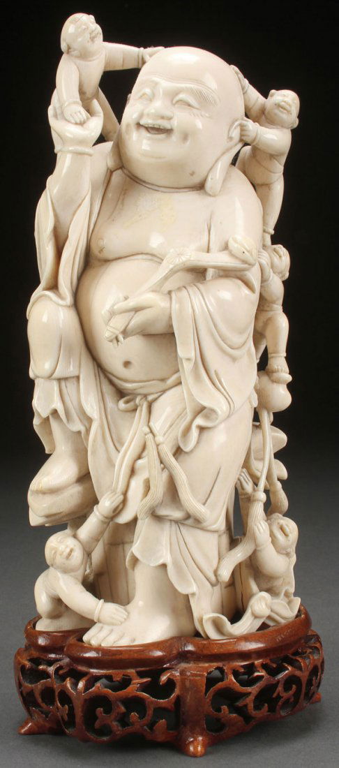 A CHINESE CARVED IVORY BUDDHA (1 of 2)