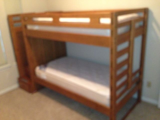 WOOD BUNK BED: WOOD BUNK BED. VERY NICE. OWNED BY DOCTOR'S FAMILY WHO USED IT AS AN EXTRA BED WHEN THEY CAME TO HOUSTON, MATTRESS SET INCLUDED. MATTRESS SET IS NEW. TWIN SIZE. WOOD FRAME WITH STORAGE OPTIONS IN STAI