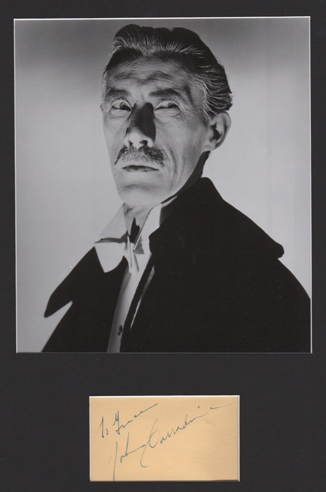 John Carradine Autograph: John Carradine Autograph. Matted with a black & white 8" x 10" photograph. This elegant and mellifluously voiced actor appeared in many John Ford films, and is best remembered by horror fans for his a