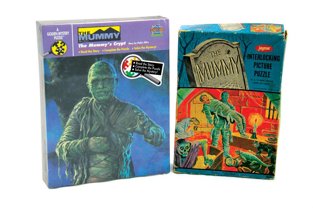 Set of 2 Mummy Jigsaw Puzzles: Set of 2 Mummy Jigsaw Puzzles. Includes Mummy puzzle by Jaymar and "The Mummy Mystery" puzzle by Golden (sealed). The box for the Jaymar puzzle exhibits wear and tear, but the puzzle pieces are in ver