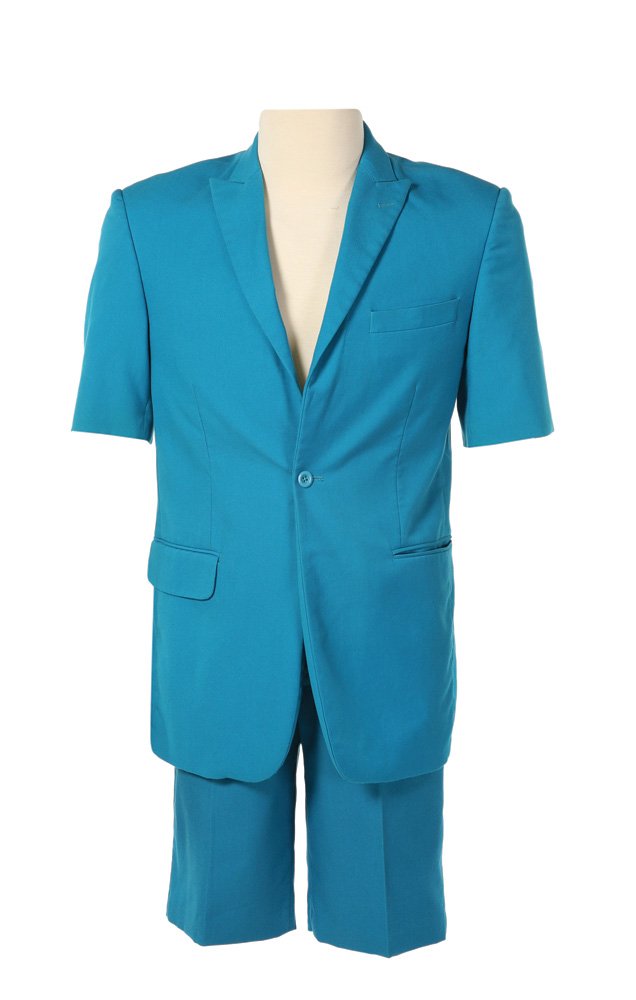 Capitol Citizen Short Sleeve Suit: Capitol Citizen Short Sleeve Suit from The Hunger Games. Bright blue short sleeve suit coat with matching blue suit shorts worn by actor Joseph McCourt as a citizen of the Capitol. Starting at $100