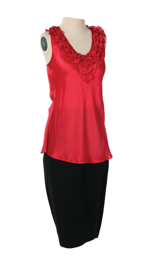 Capitol Citizen Costume: Capitol Citizen Costume from The Hunger Games. A pink shirt paired with a black pencil skirt worn by actress Angela Hamber as citizen of the Capitol in the audience of the "Avenue of the Tributes" par