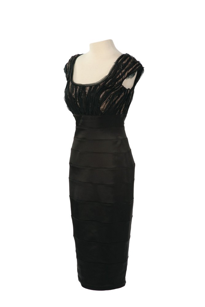 Capitol Citizen Black Dress: Capitol Citizen Black Dress from The Hunger Games. Black dress worn by actress Orjana Chamberlin as an audience member at the "Avenue of the Tributes" parade. Starting at $100