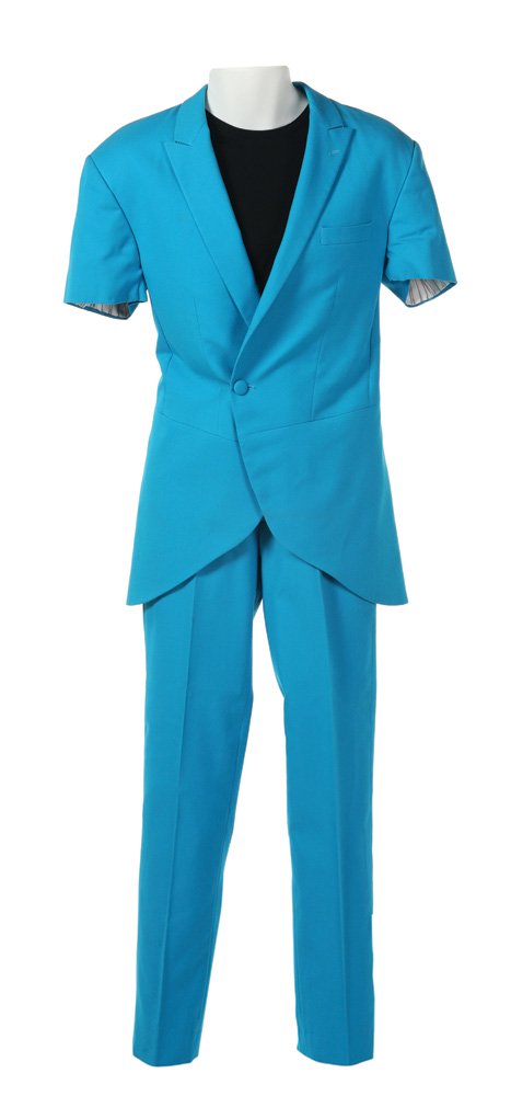 Capitol Citizen Blue Suit: Capitol Citizen Blue Suit from The Hunger Games Worn by actor Bennet Hampton as a citizen of the Capitol, this costume includes a bright blue long suit jacket with short sleeves, a pair of bright blue