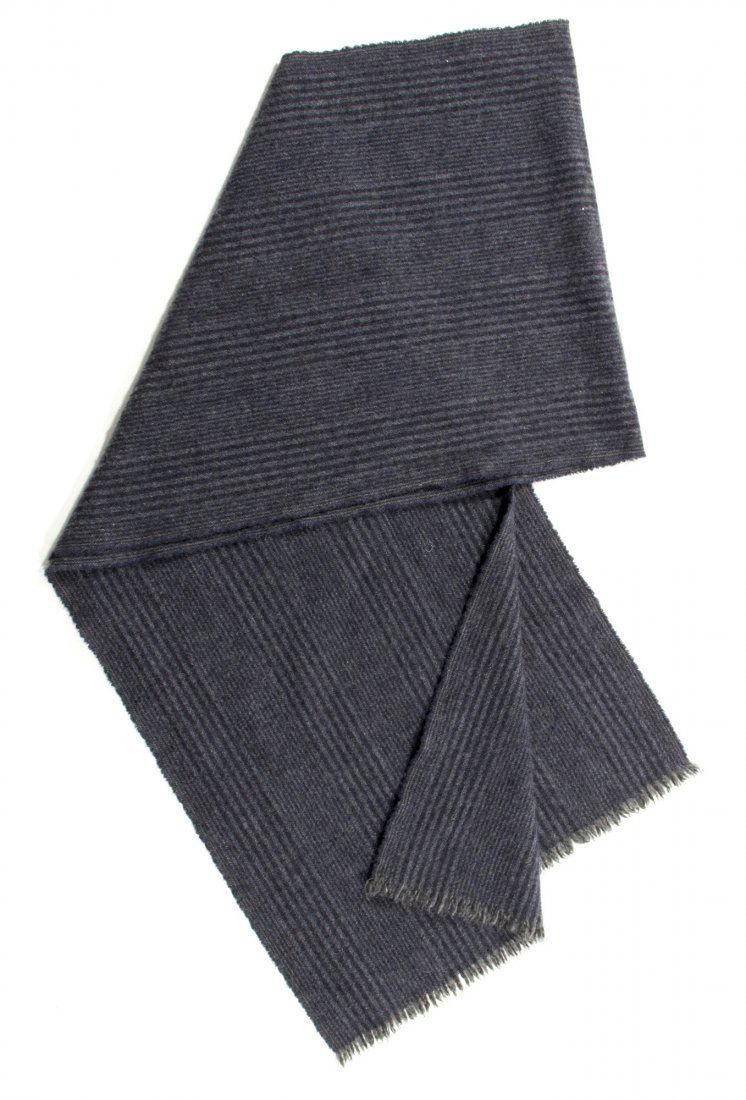 Mikael Blomkvist Scarf from The Girl with the Dragon: Jil Sander gray striped scarf used by Mikael Blomkvist, as portrayed by Daniel Craig, in The Girl with the Dragon Tattoo (Columbia Pictures, 2011). Accompanied by costumer's tag indicating this costum